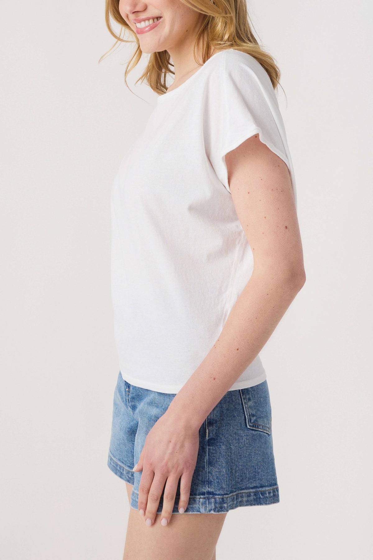 White short-sleeve crew-neck tee with relaxed fit, side view