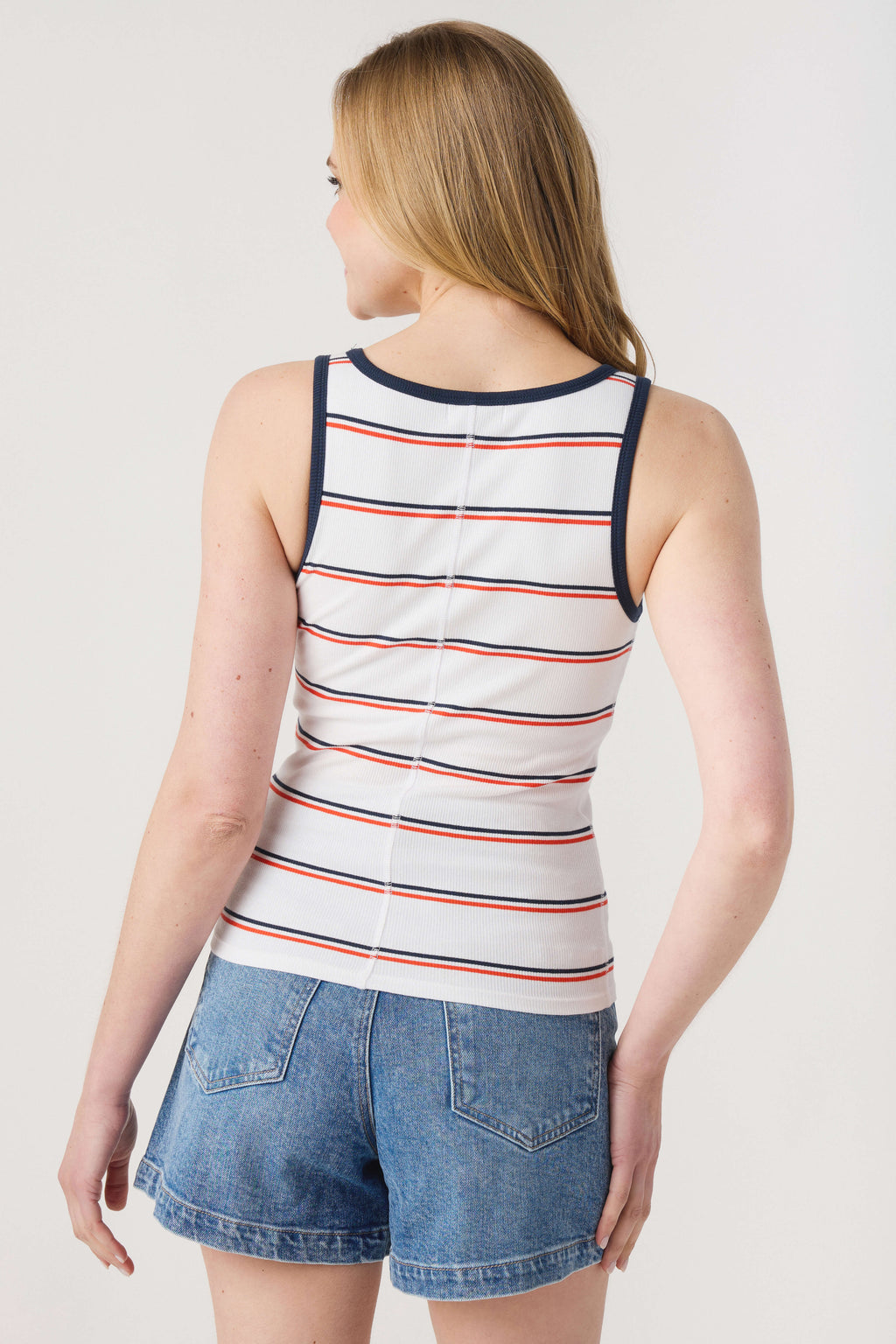 White ribbed tank back with navy trim and red/gray horizontal stripes.