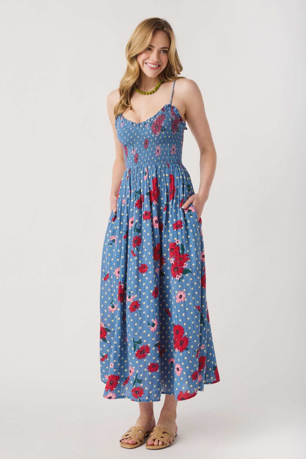 Blue floral midi dress with scoop neckline, spaghetti straps and gathered waist