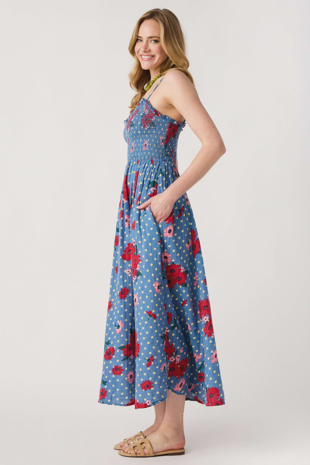 Blue floral midi dress with spaghetti straps and flowing flared skirt