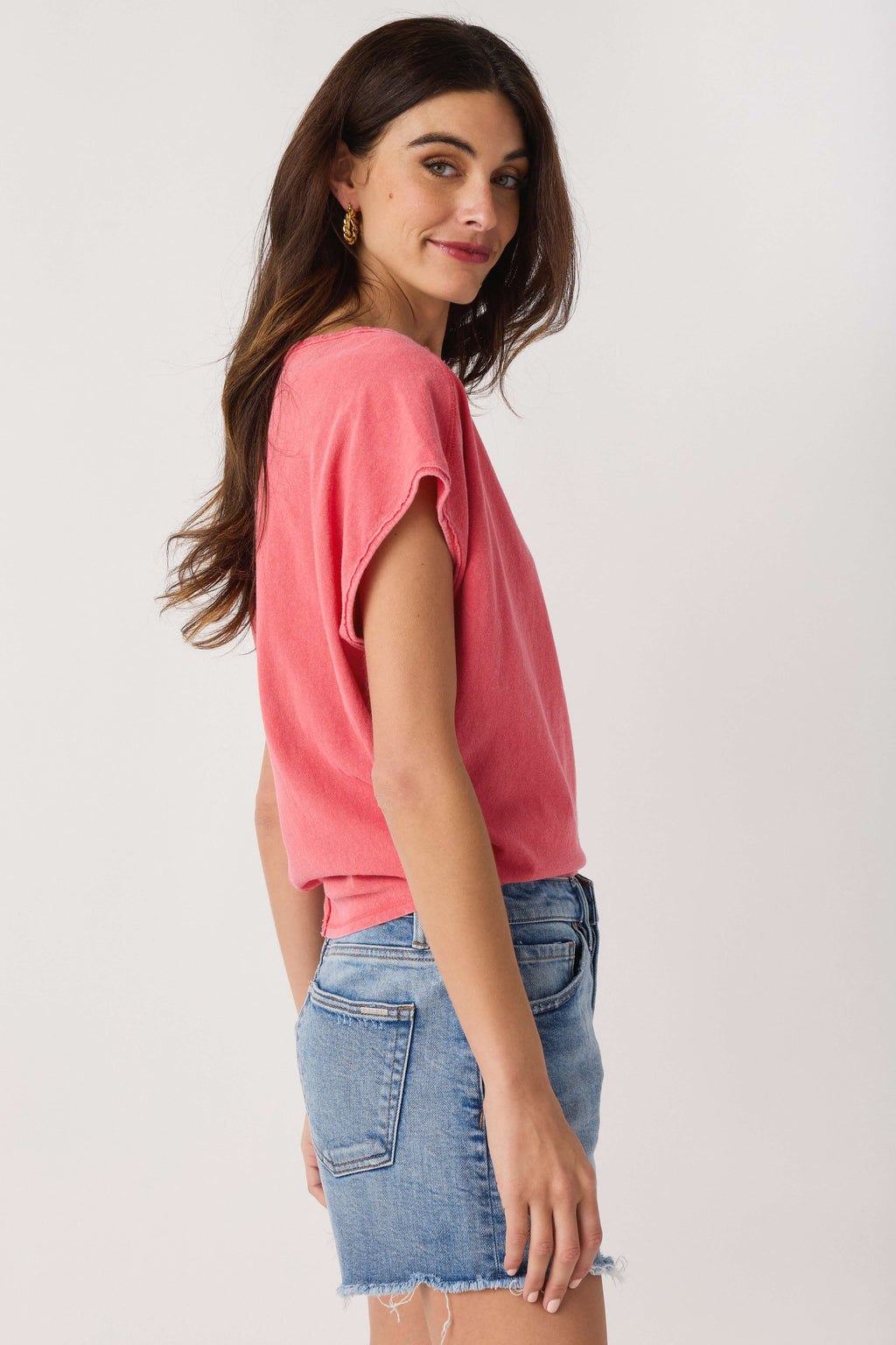 Pink short-sleeve crew-neck tee with relaxed fit, side view