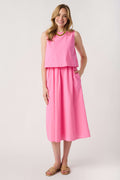 Pink tiered midi dress with sleeveless bodice and green-trimmed neckline