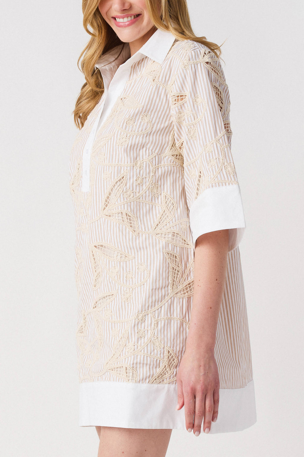 Floral embroidered shirt dress with white contrast cuff and hem; light taupe vertical embroidery.