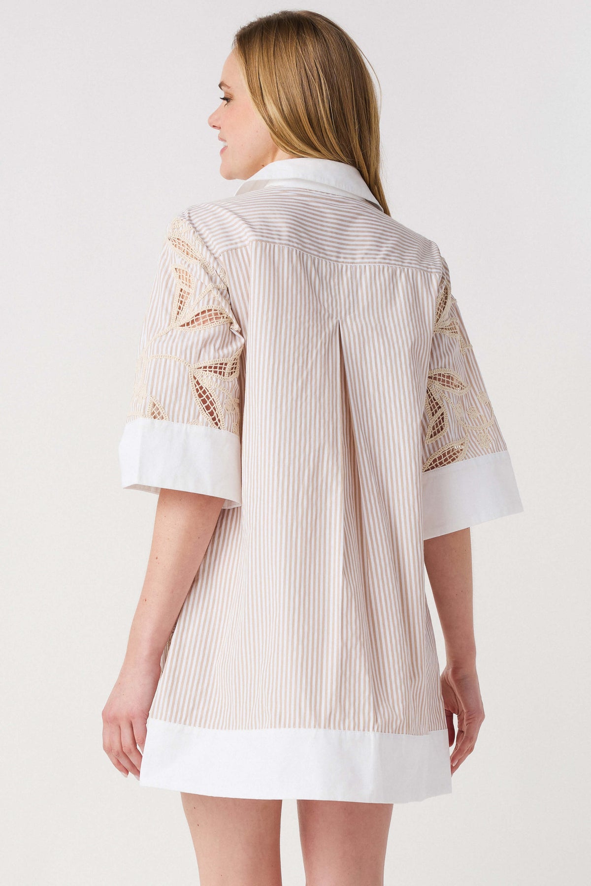 Floral embroidered shirt dress back with white hem and cuff details; light taupe stripes.