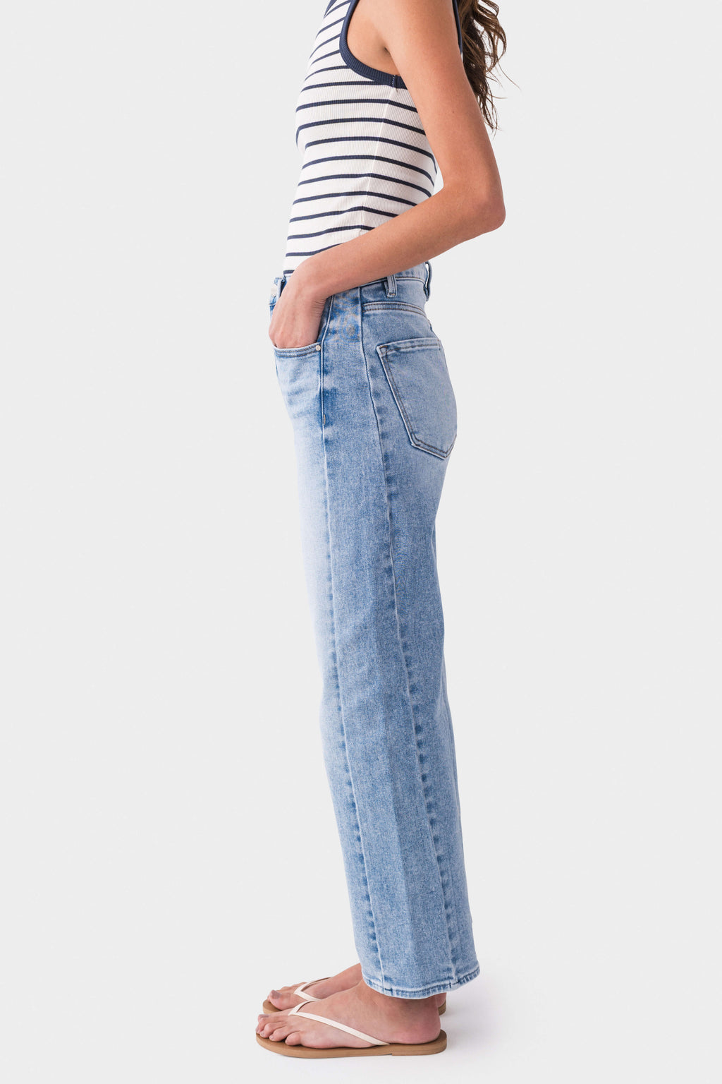 High-rise barrel jeans in light wash blue, side view with wide straight leg