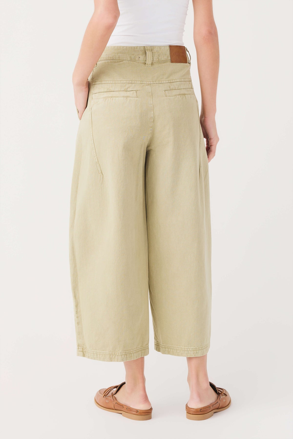 Aloe green chino pants with high-rise waist, belt loops, and cropped straight legs