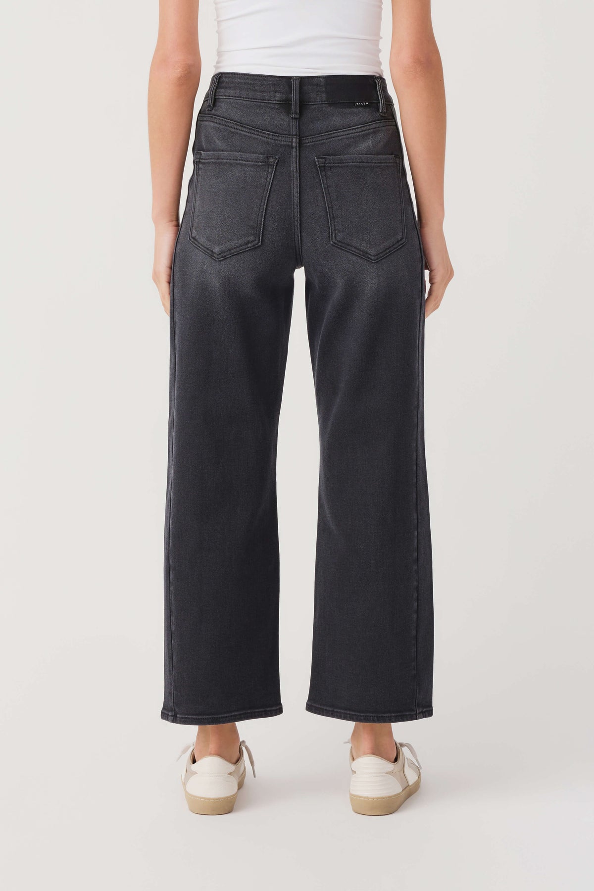 High-rise barrel jeans in dark wash denim, straight wide legs with front slash pockets
