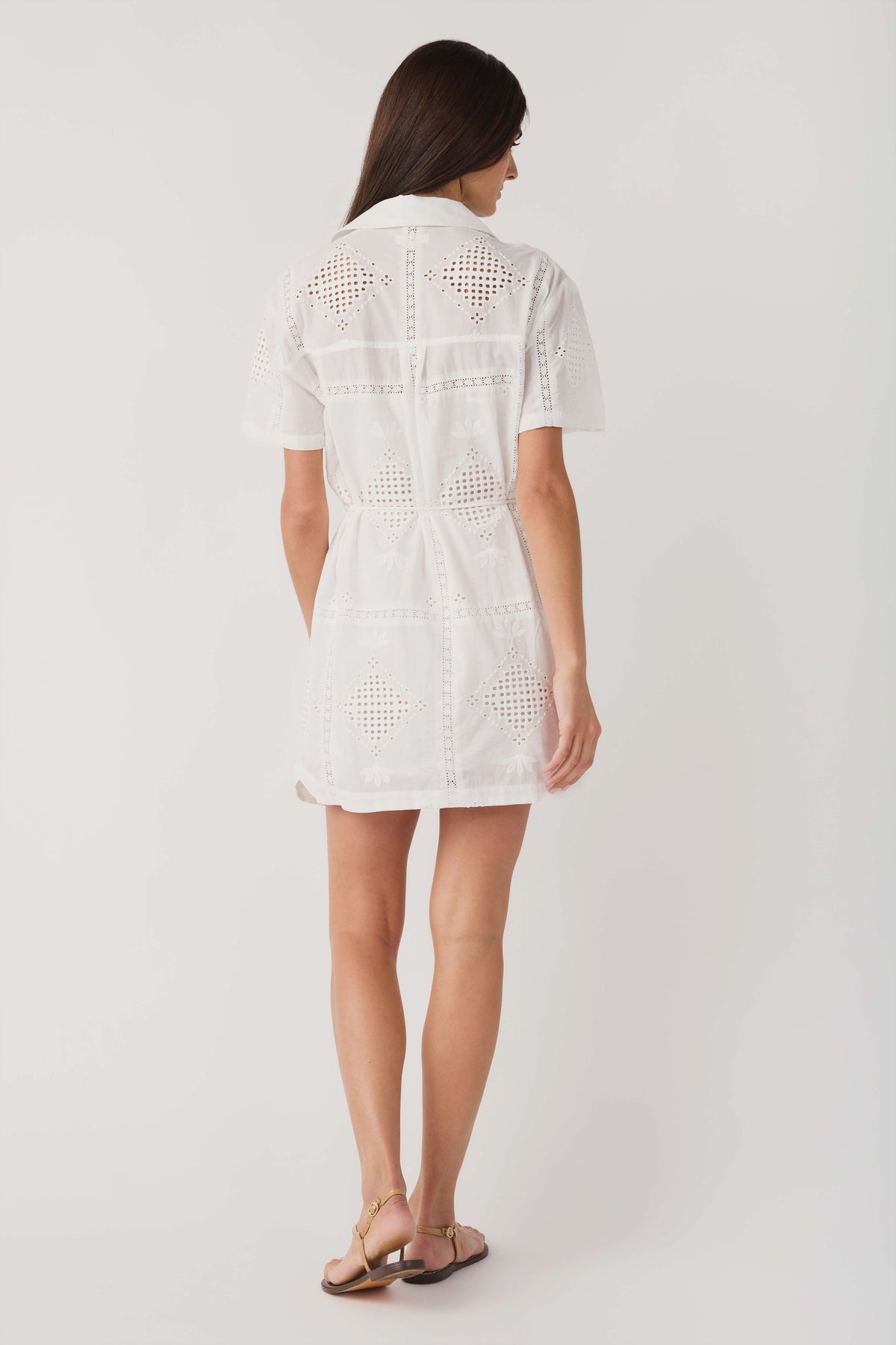 White eyelet mini dress with short sleeves and eyelet back yoke, rear view