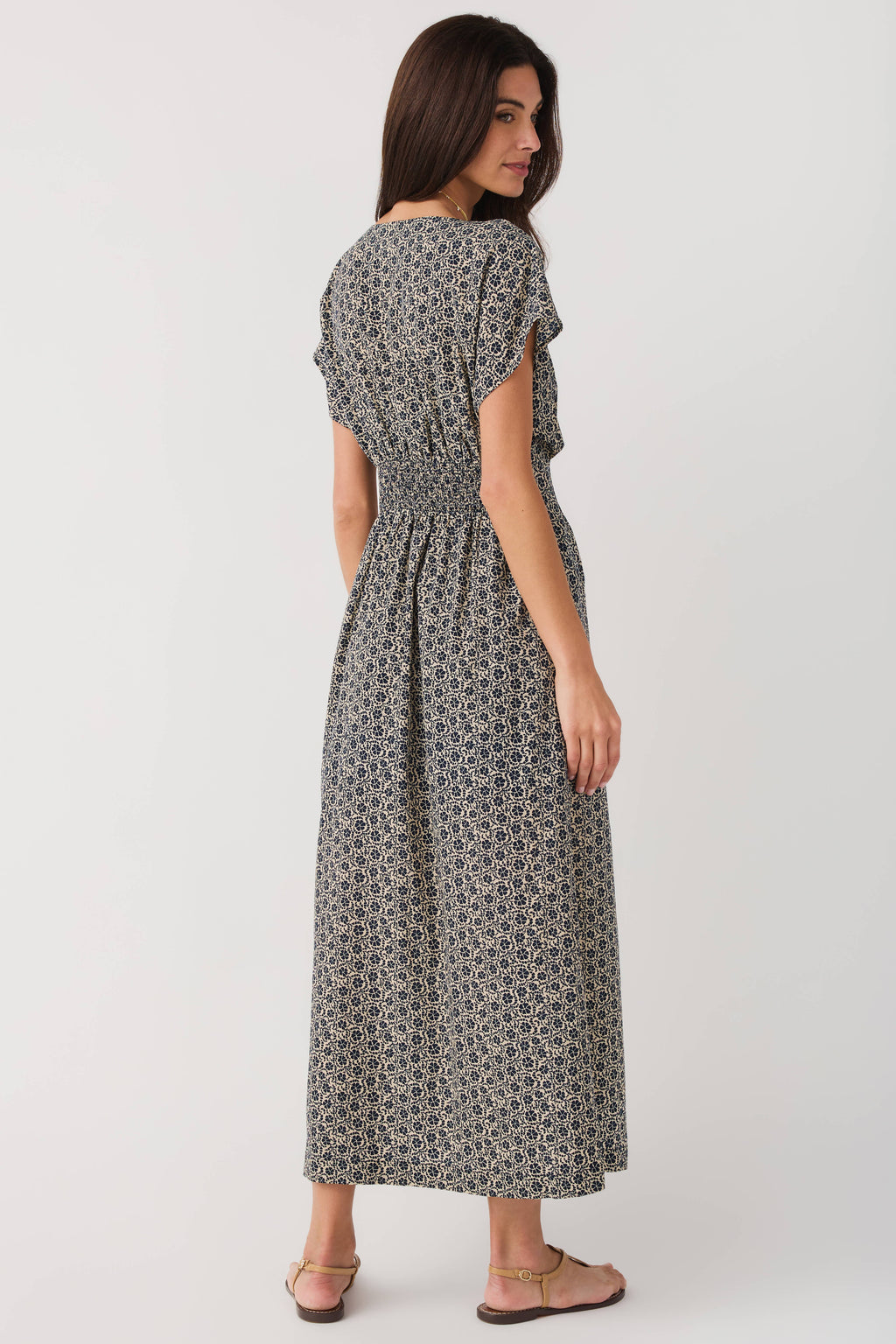 Z Supply dark floral midi dress viewed from back, gathered waist and flutter sleeves