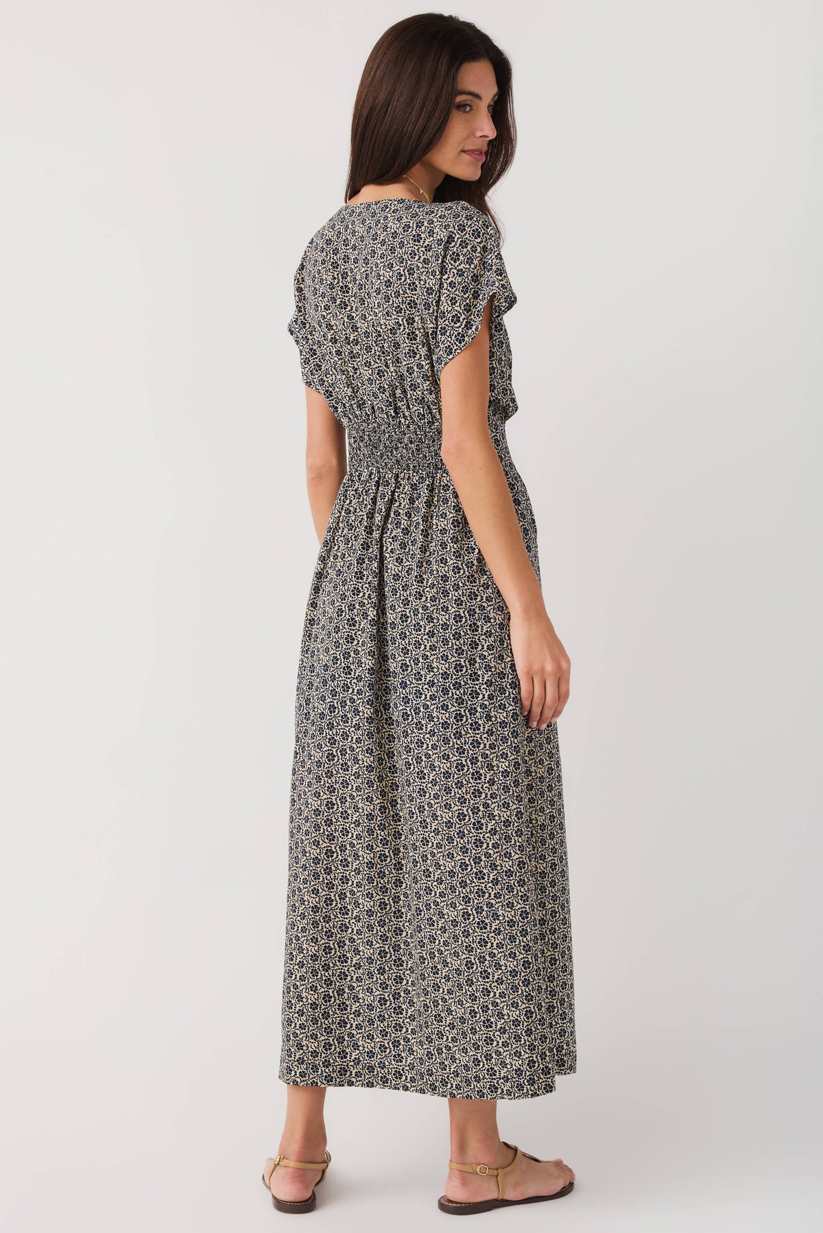 Z Supply dark floral midi dress viewed from back, gathered waist and flutter sleeves