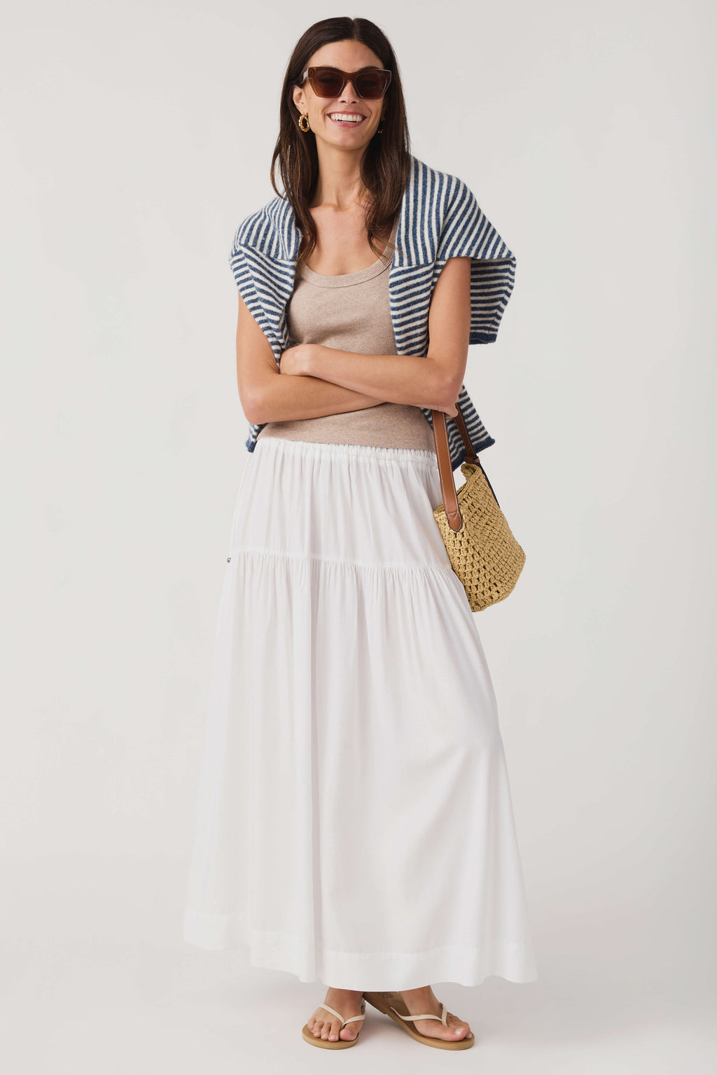 Scoop neck tank top layered under blue-and-white striped top