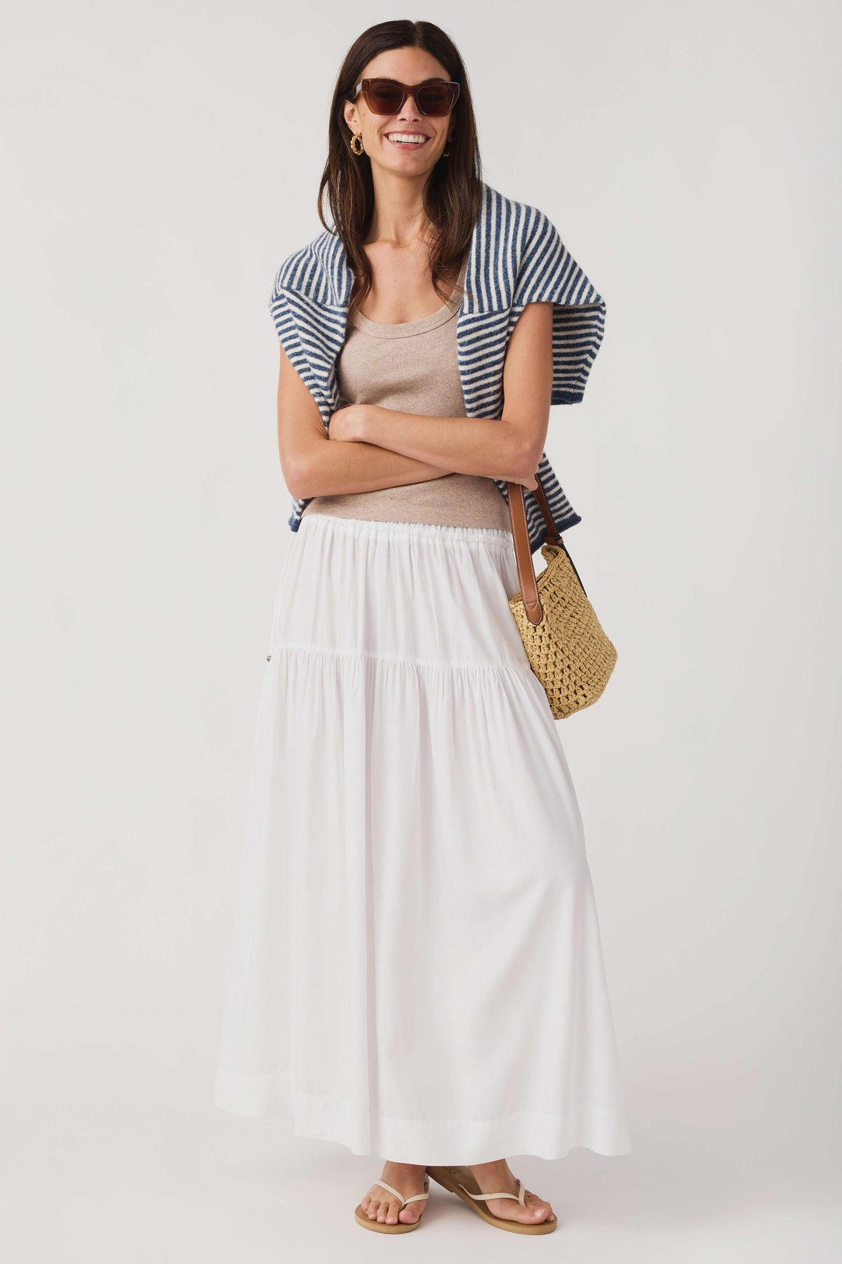 Scoop neck tank top layered under blue-and-white striped top