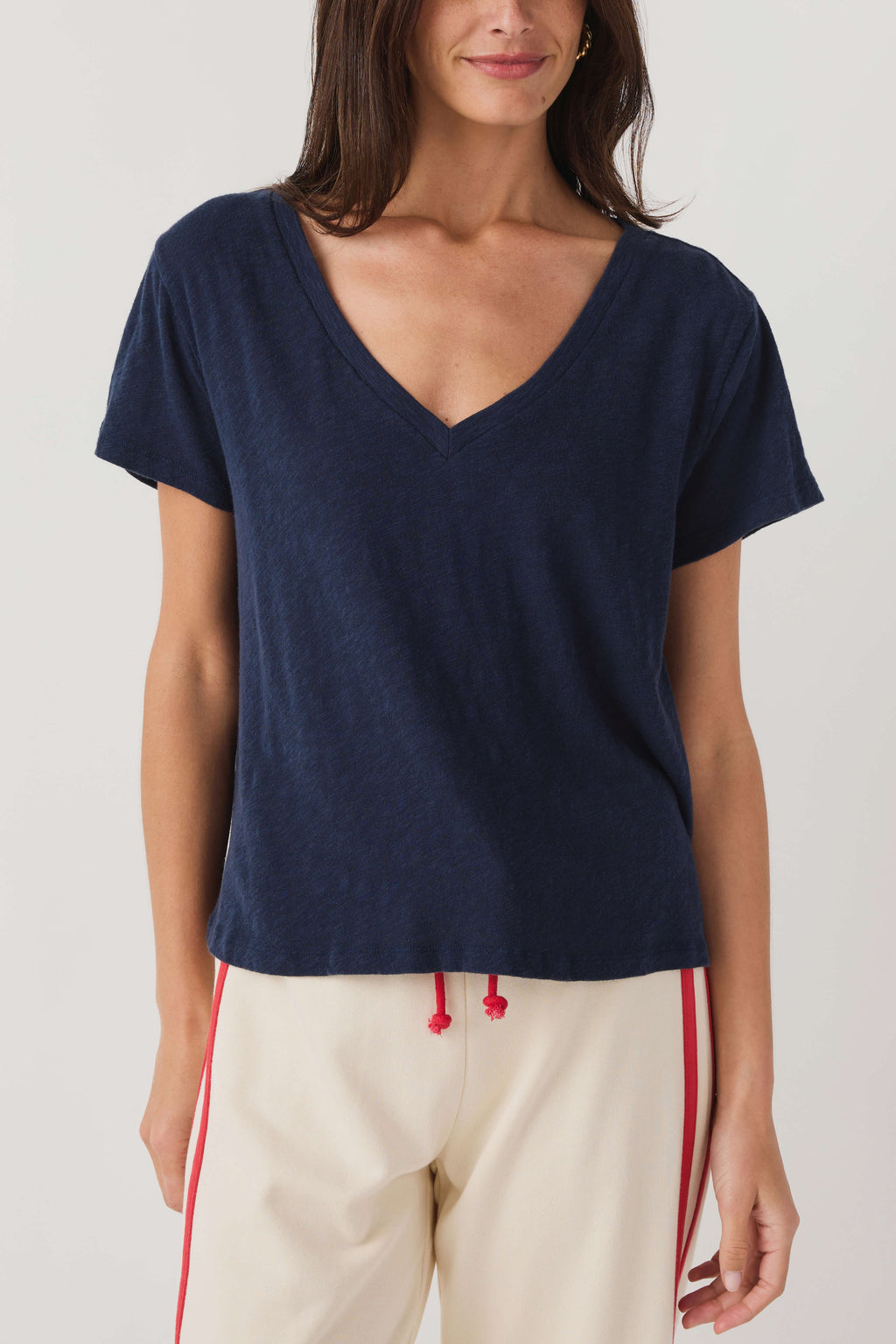 Navy V-neck short-sleeve tee with simple front and soft jersey weave