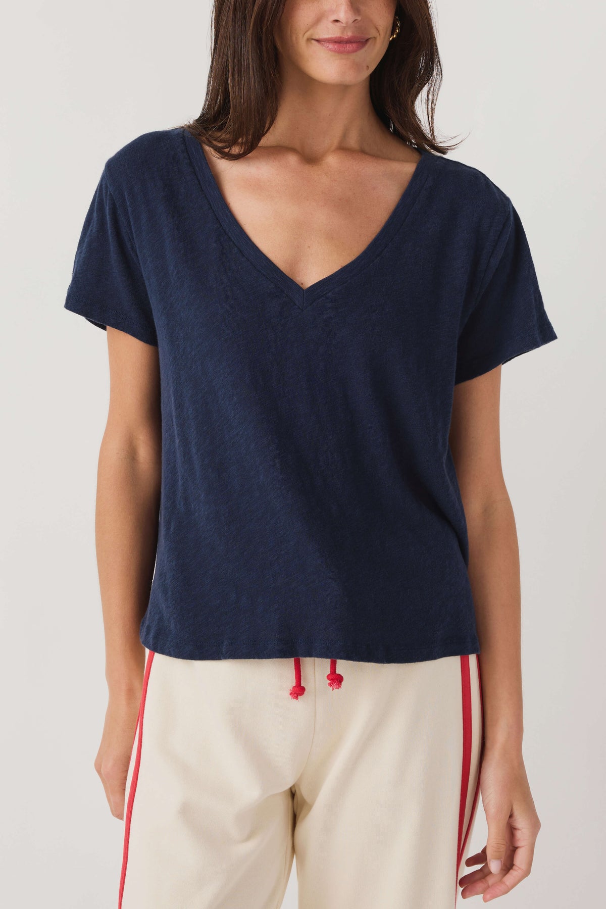 Navy V-neck short-sleeve tee with simple front and soft jersey weave