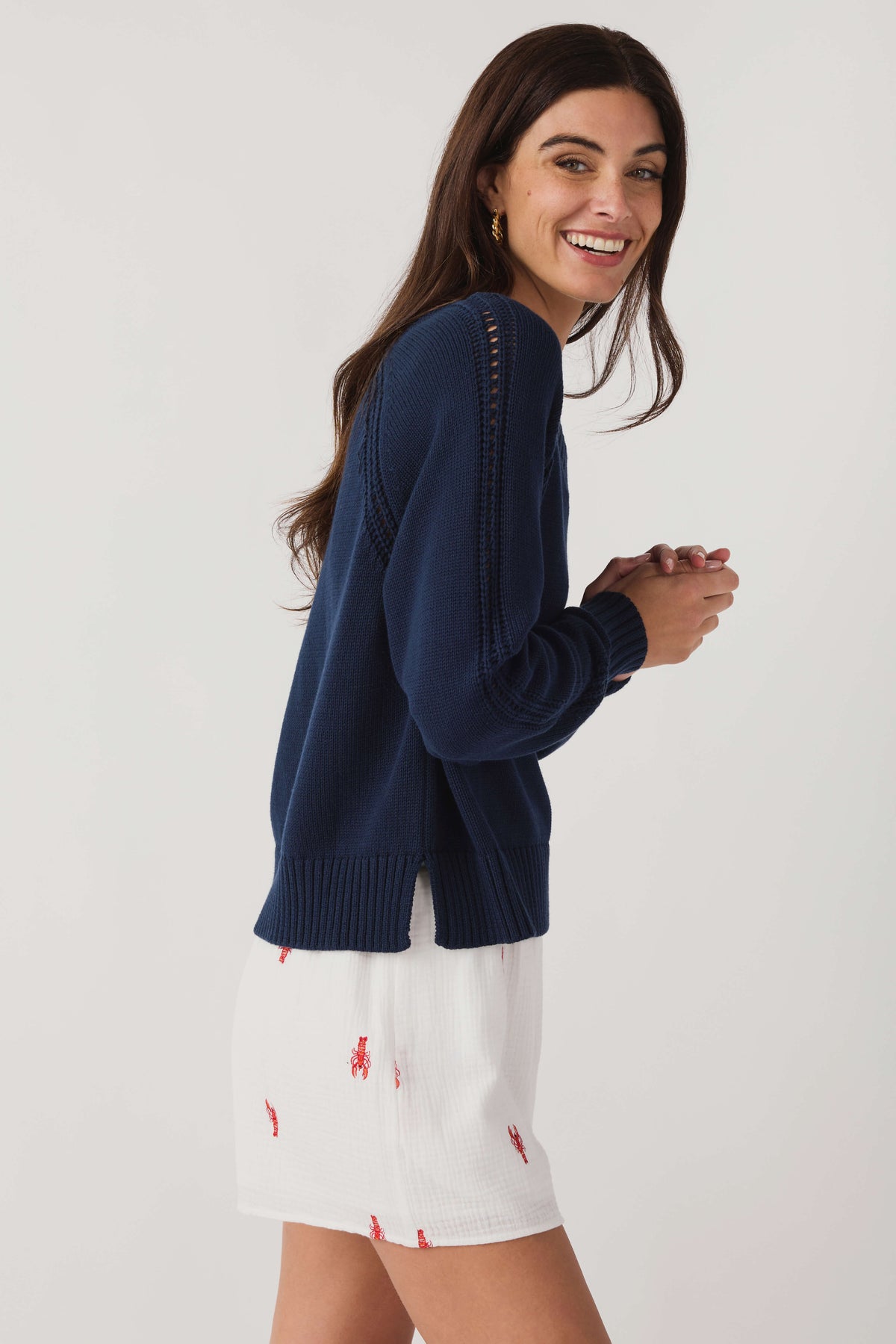 Women's Eclipse navy V-neck knit sweater with ribbed cuffs and decorative dotted shoulders