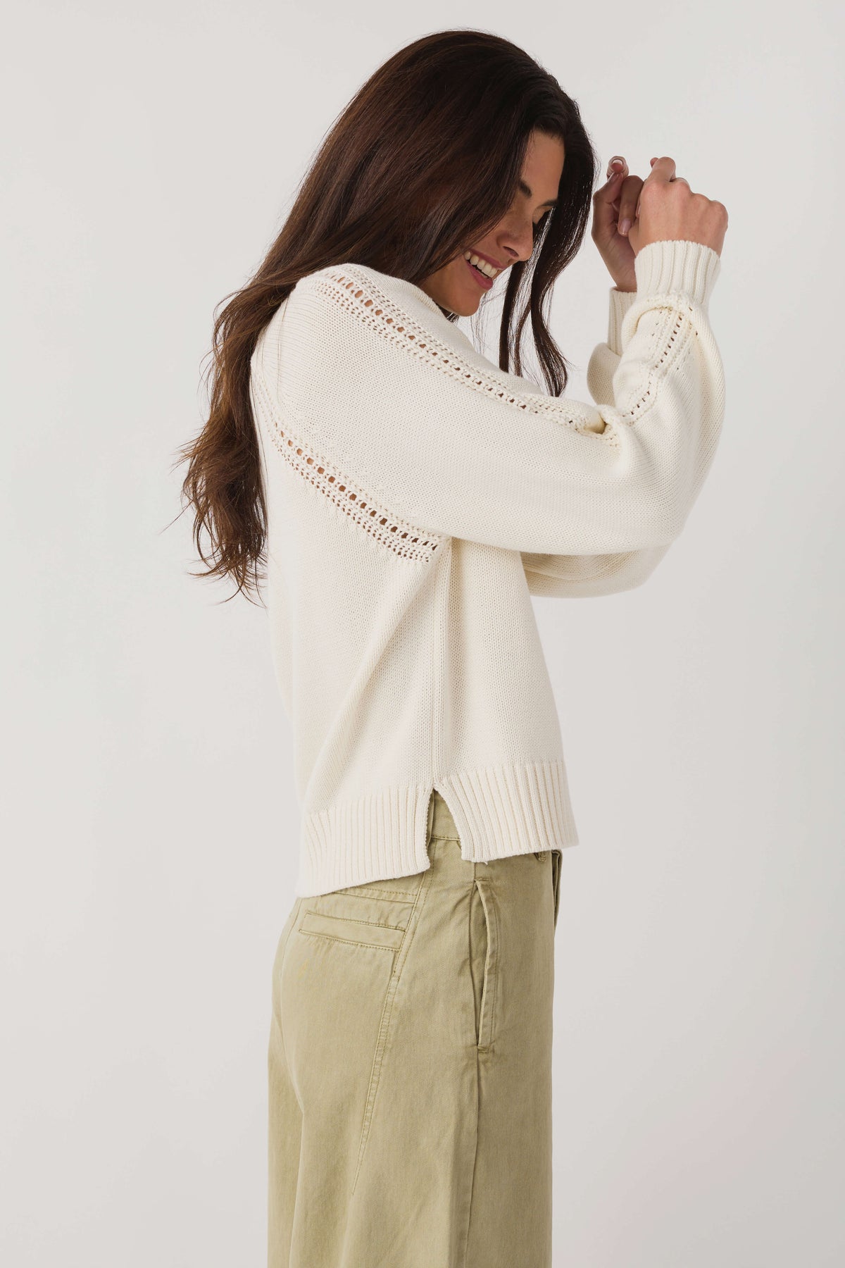 Women's light sand V-neck knit sweater with dotted shoulder trim and ribbed cuffs