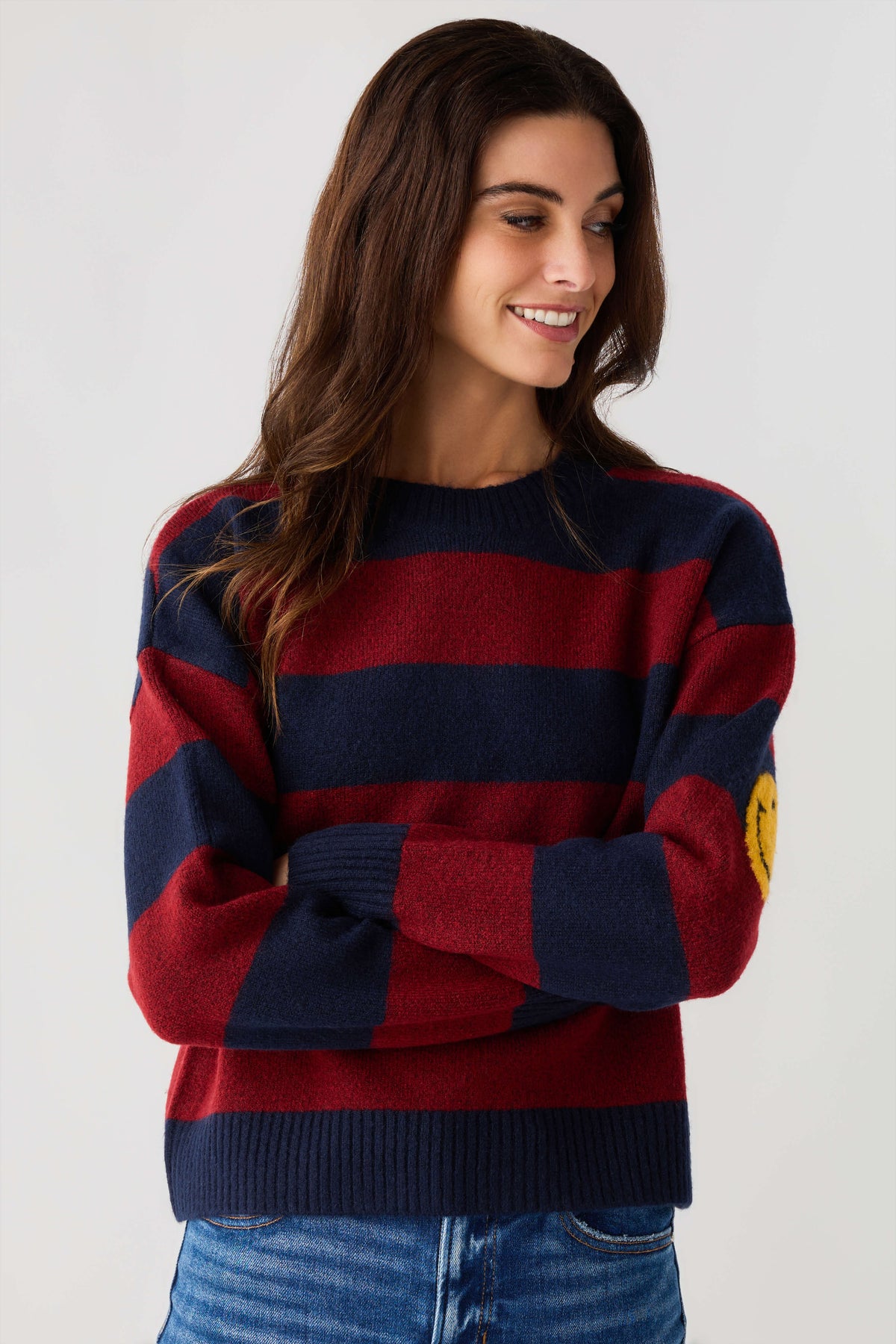 Striped smiley face sweater in navy and burgundy horizontal stripes, smiley detail