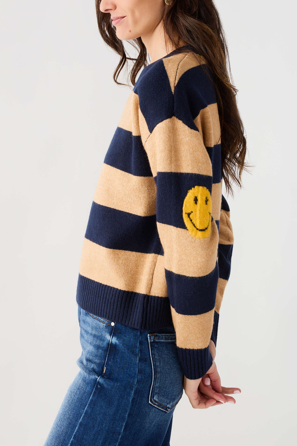 Navy and camel striped sweater with yellow smiley face patch, long sleeves