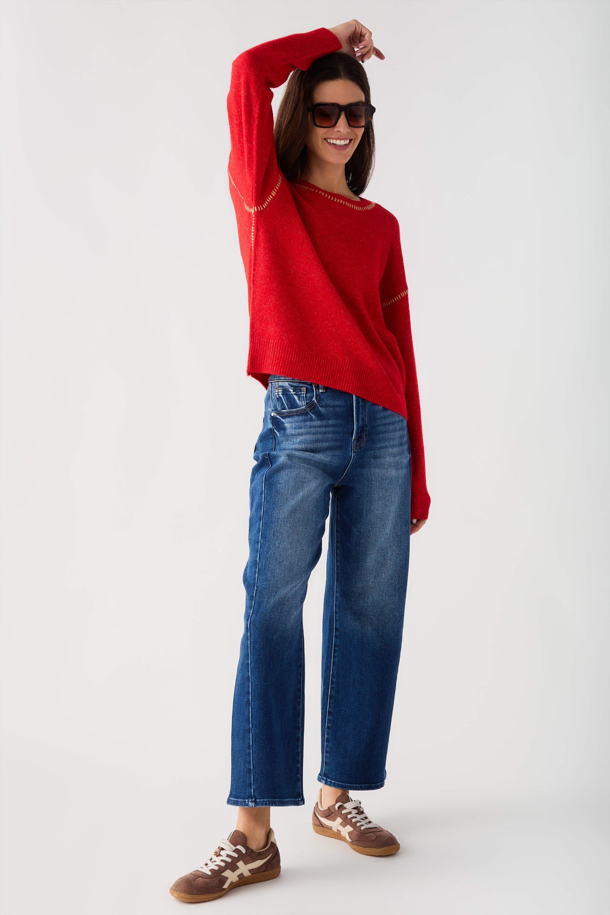 Red crewneck sweater with contrast stitch at neckline and sleeve seams