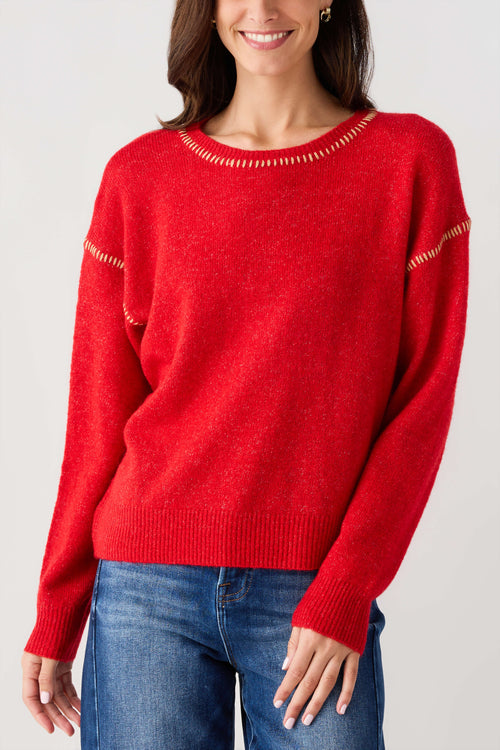 Red crewneck sweater with contrast stitch neckline and sleeve details