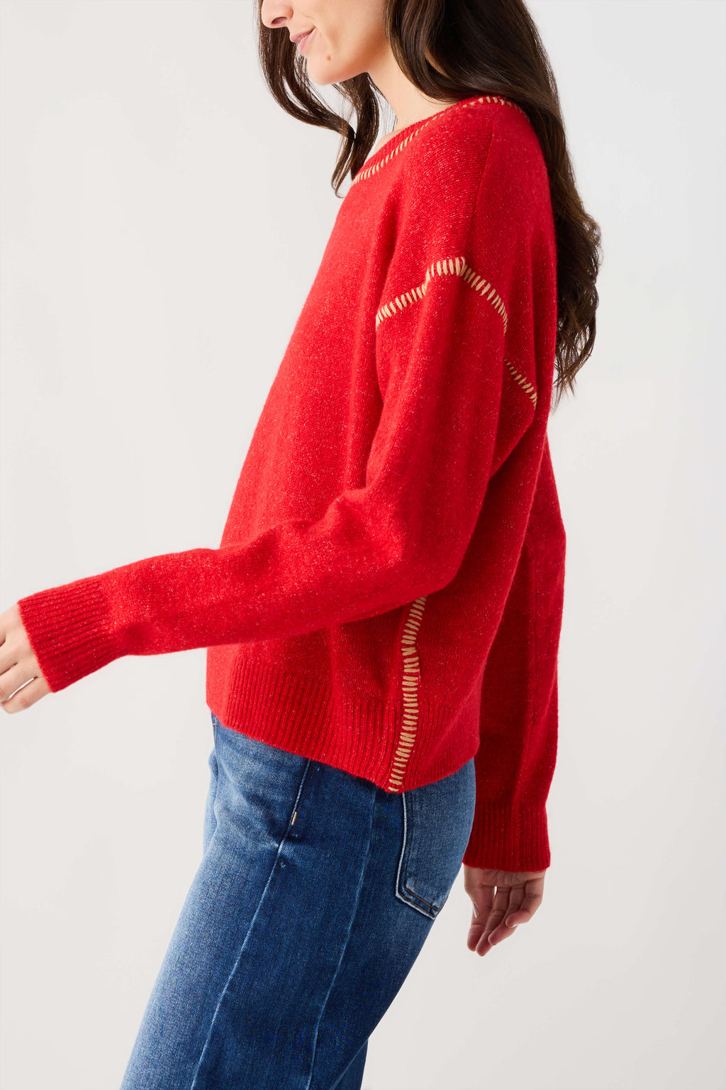 Red knit sweater with contrast stitch accents and ribbed cuffs
