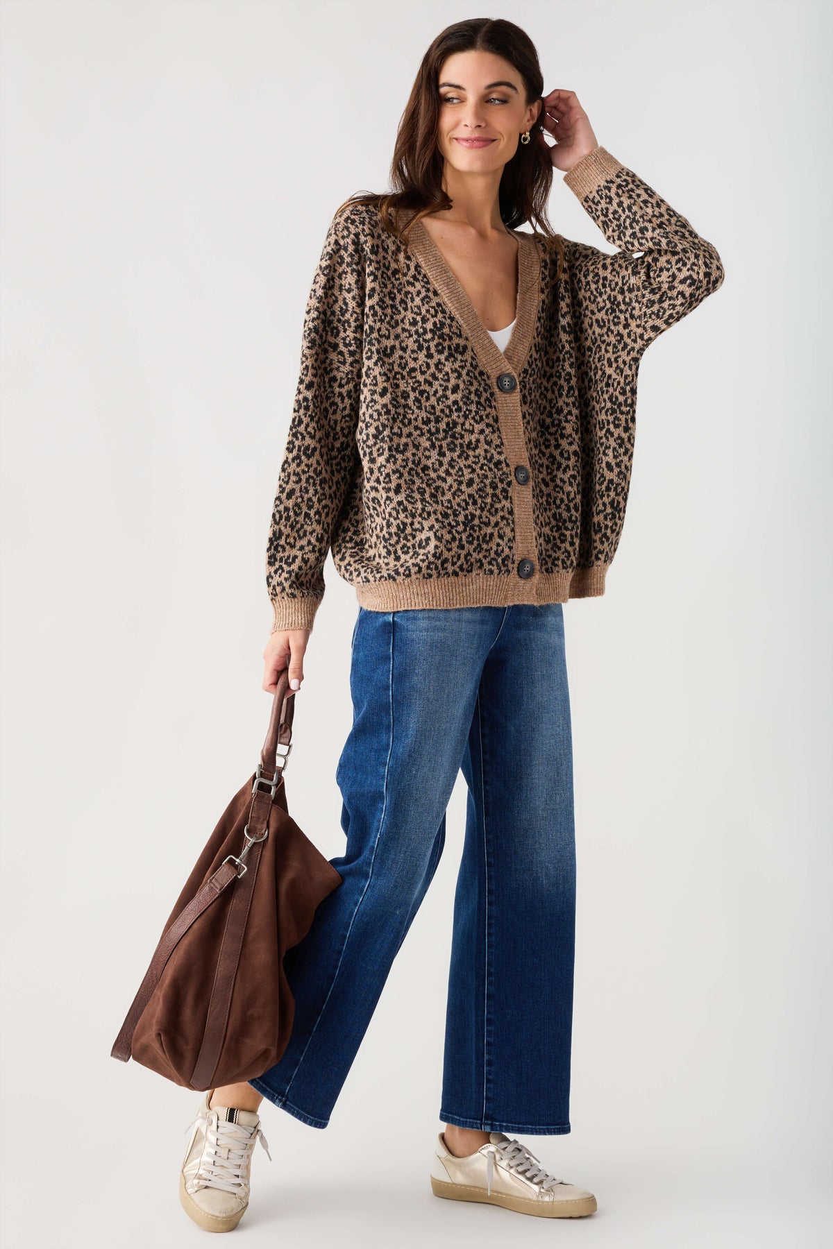 Dark brown suede slouch tote with short handles and long crossbody strap