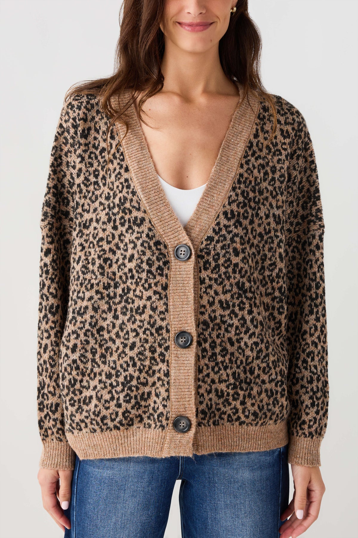 Leopard print cardigan sweater detail: button placket, V neckline, ribbed hem