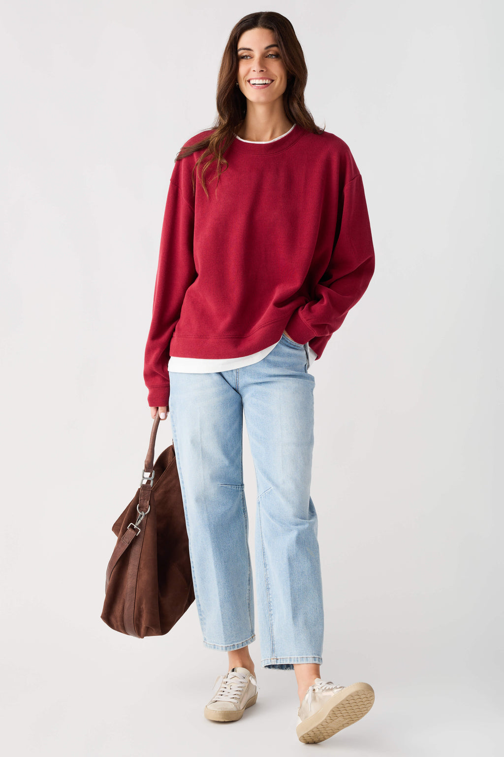 Cranberry red crew pullover with crew neck, long sleeves, and ribbed cuffs