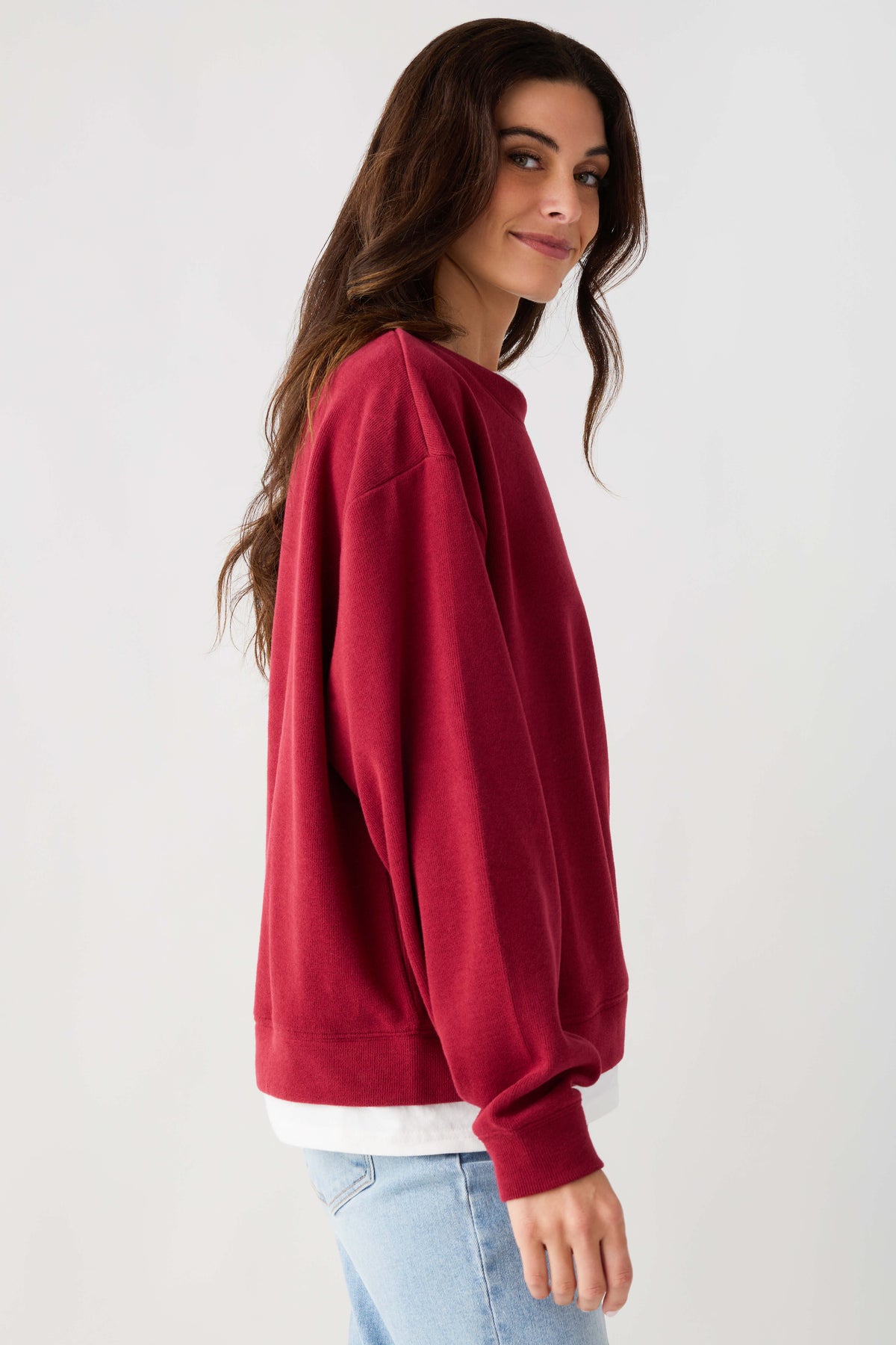 Crewneck pullover sweatshirt in cranberry red with ribbed cuffs and hem band.
