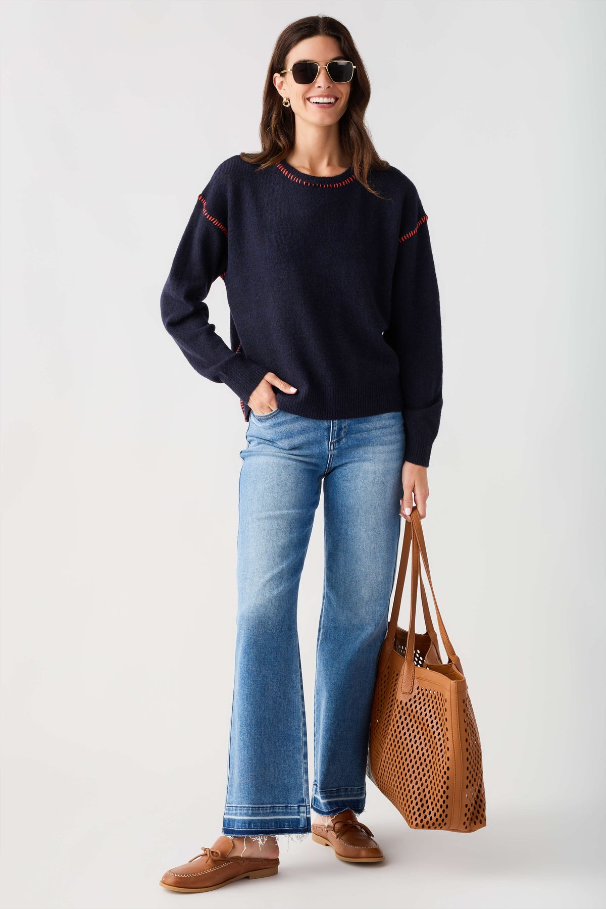 Navy crewneck sweater with contrast stitch trim on neckline and cuffs
