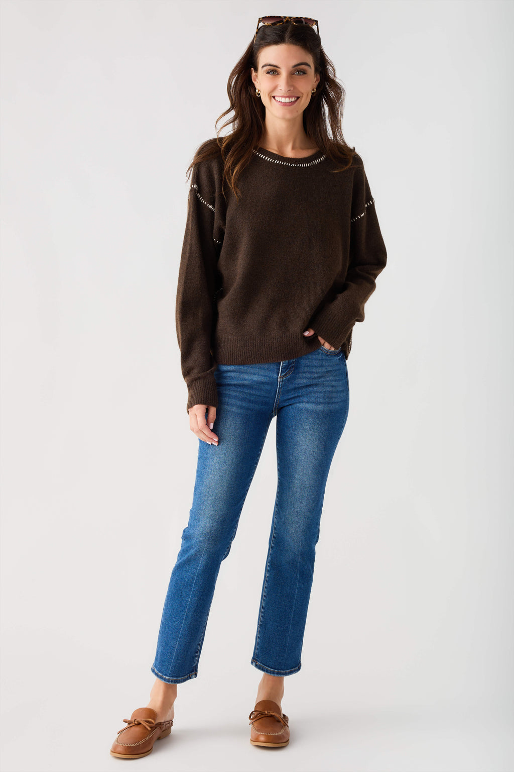 Brown crewneck sweater with contrasting trim at seams and neckline
