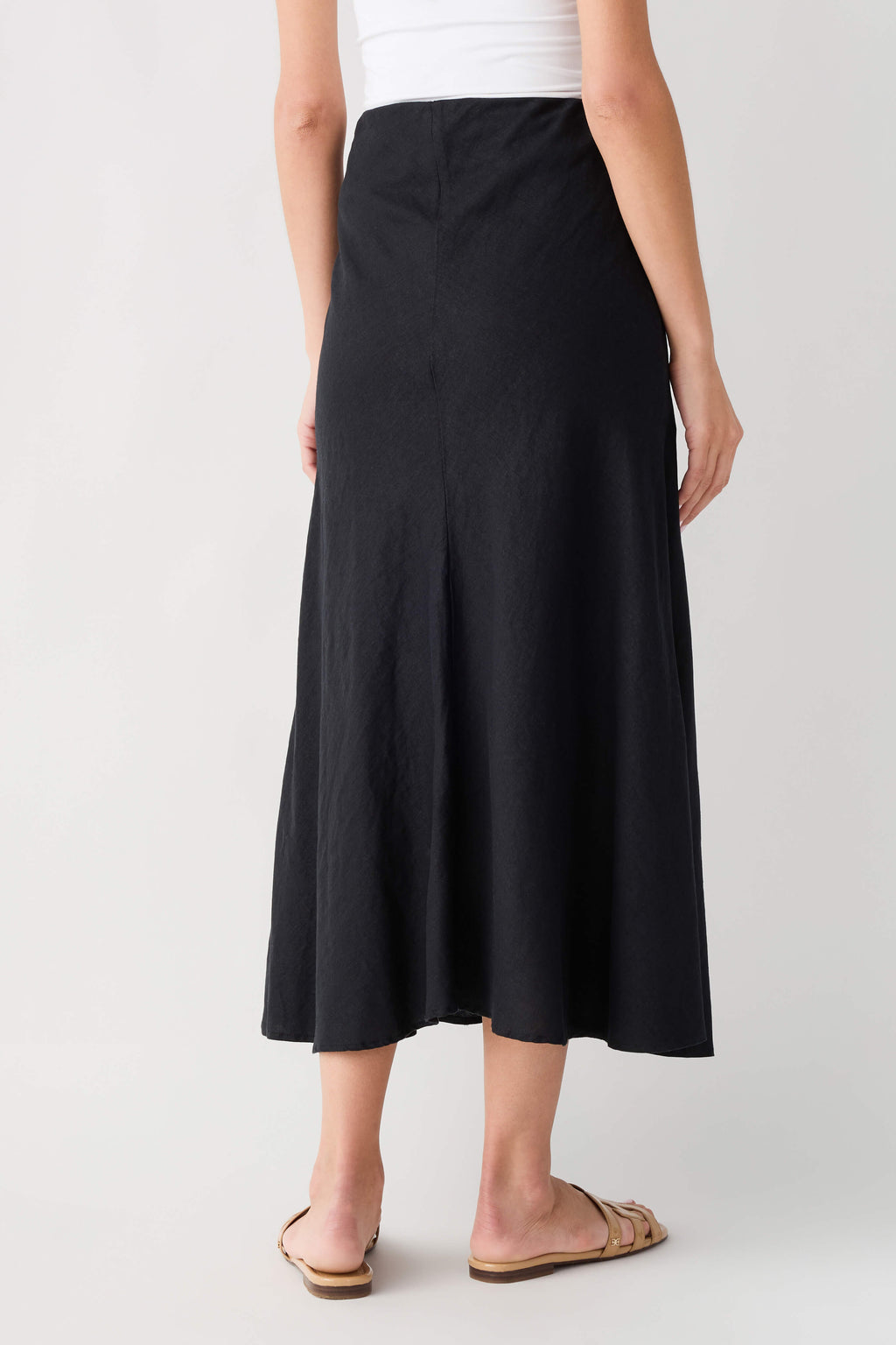 Black midi A-line skirt with smooth front and softly flared hem