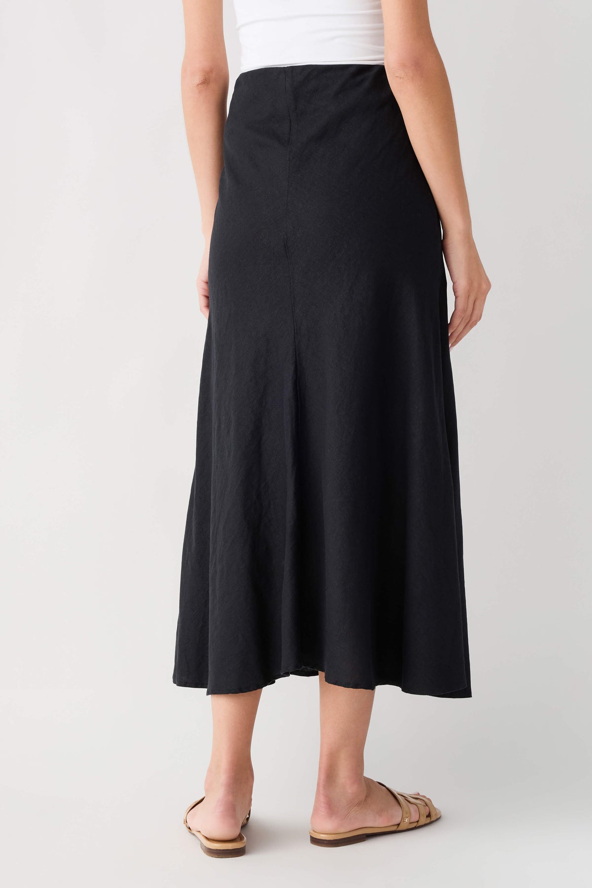Black midi A-line skirt with smooth front and softly flared hem