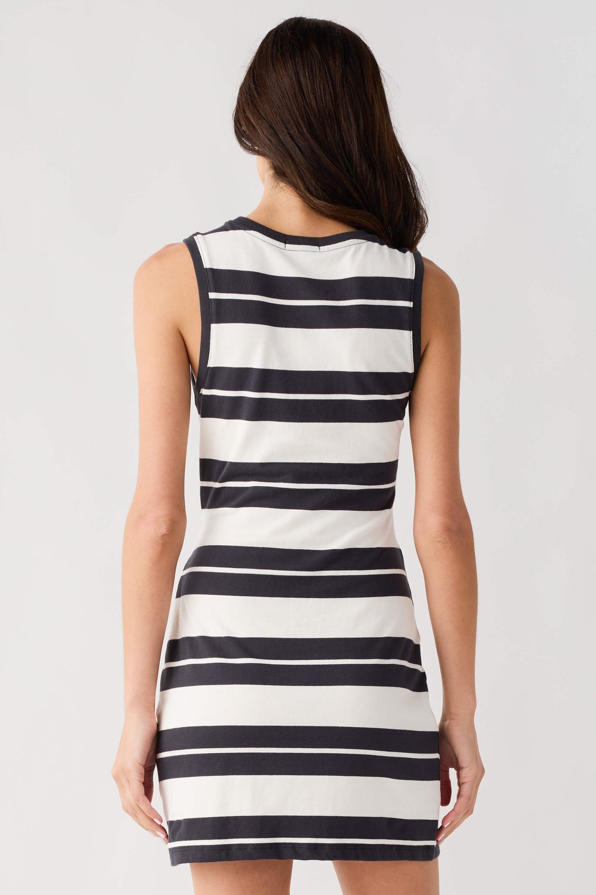 Back view of sleeveless striped mini dress, black and white horizontal stripes