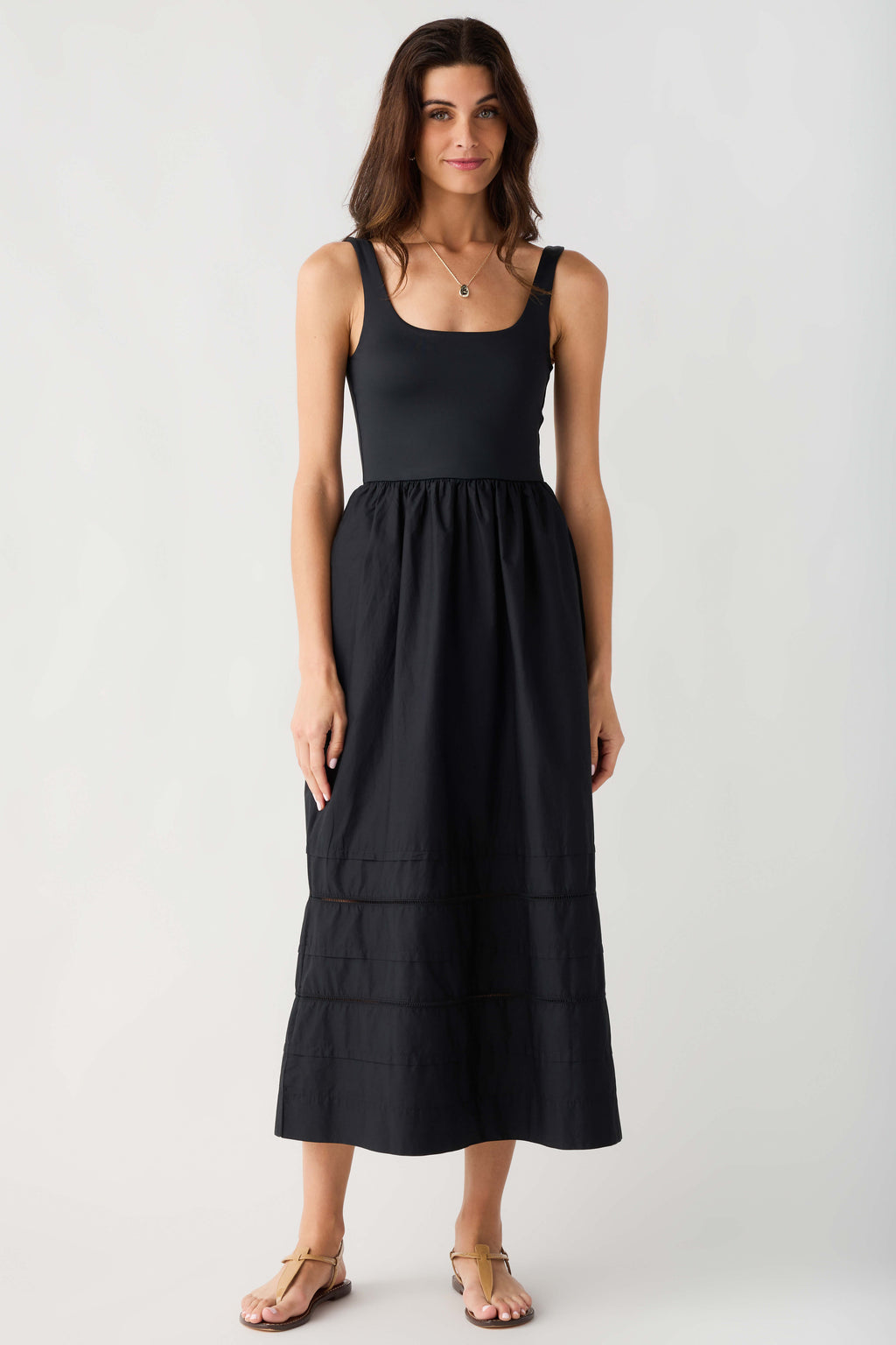 Black sleeveless midi dress with square neckline and gathered tiered skirt