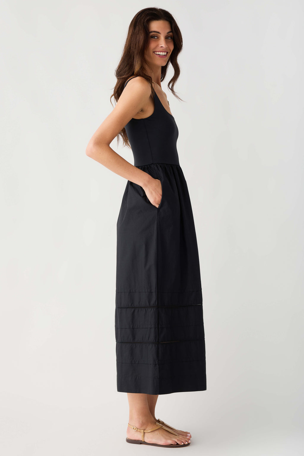 Black sleeveless midi dress with square neckline and tiered skirt