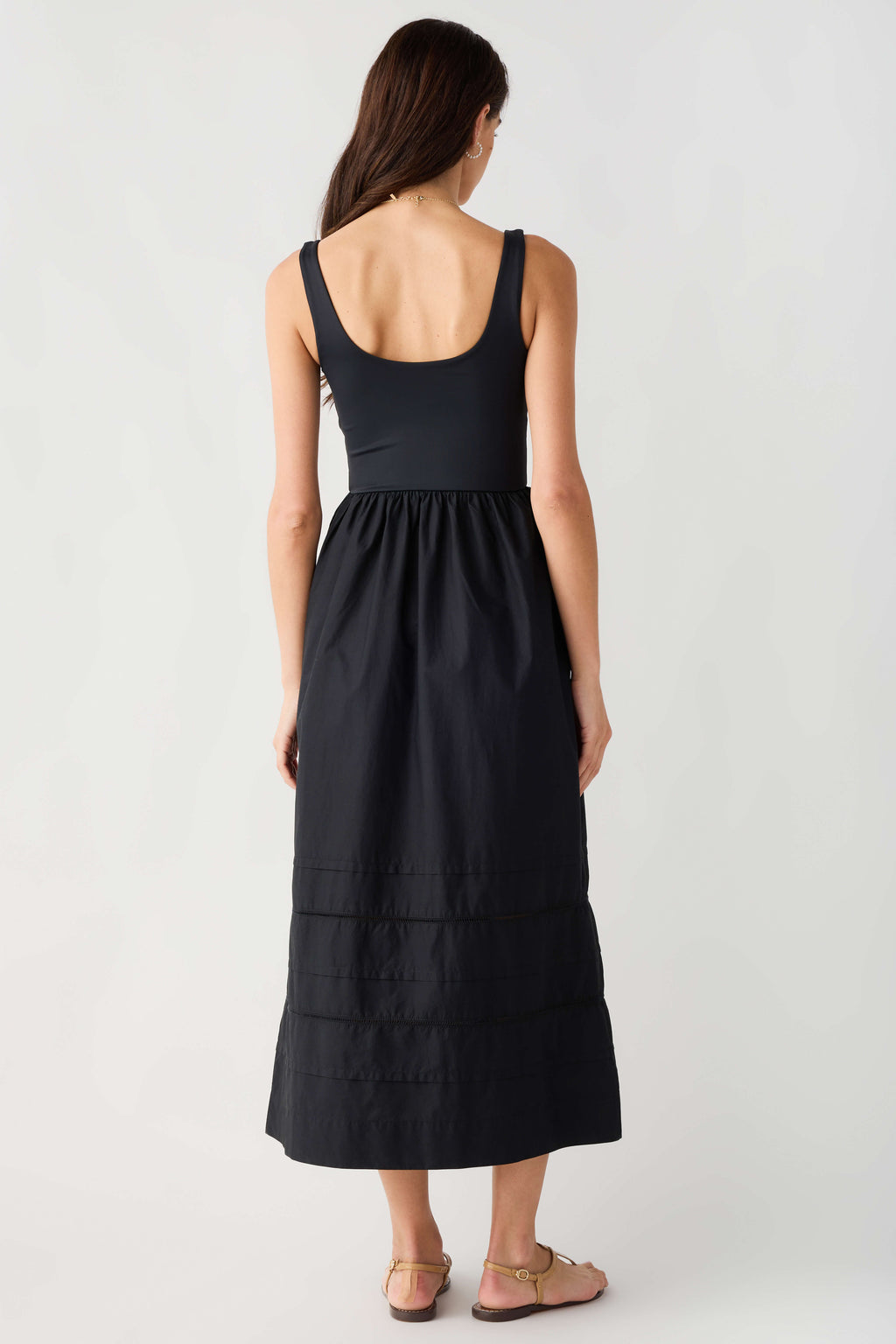 Black sleeveless midi dress with scoop back and tiered skirt