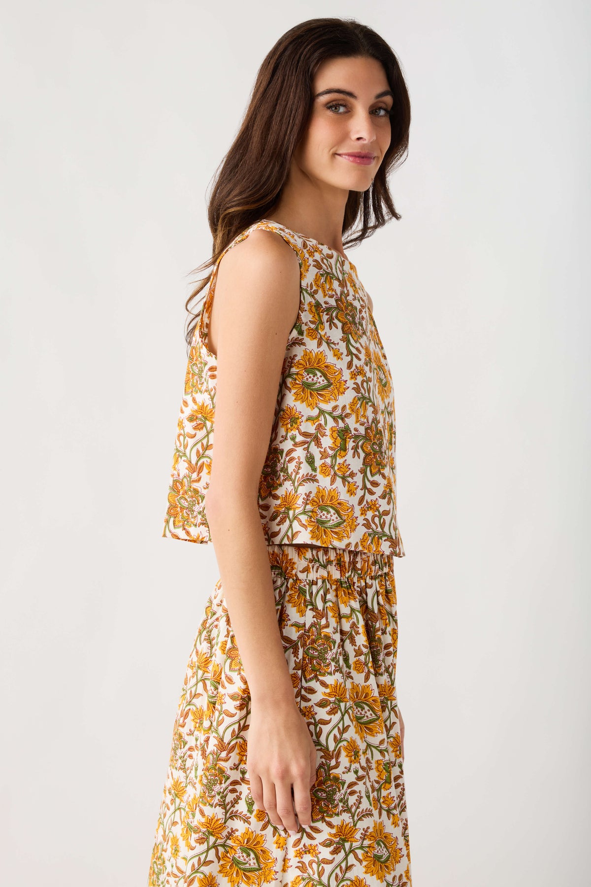 Floral print sleeveless top with gathered peplum hem and elastic waist