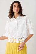 White poplin button-front top with pointed collar and lace hem trim