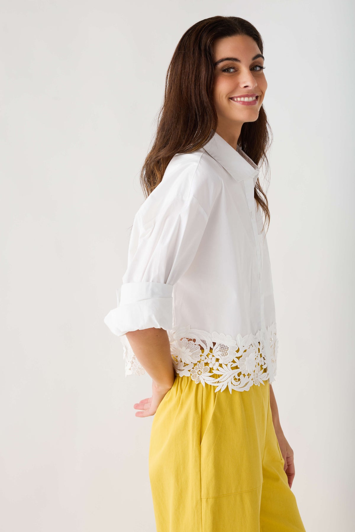 White poplin shirt top with lace trim across the lower front and cuffed sleeves