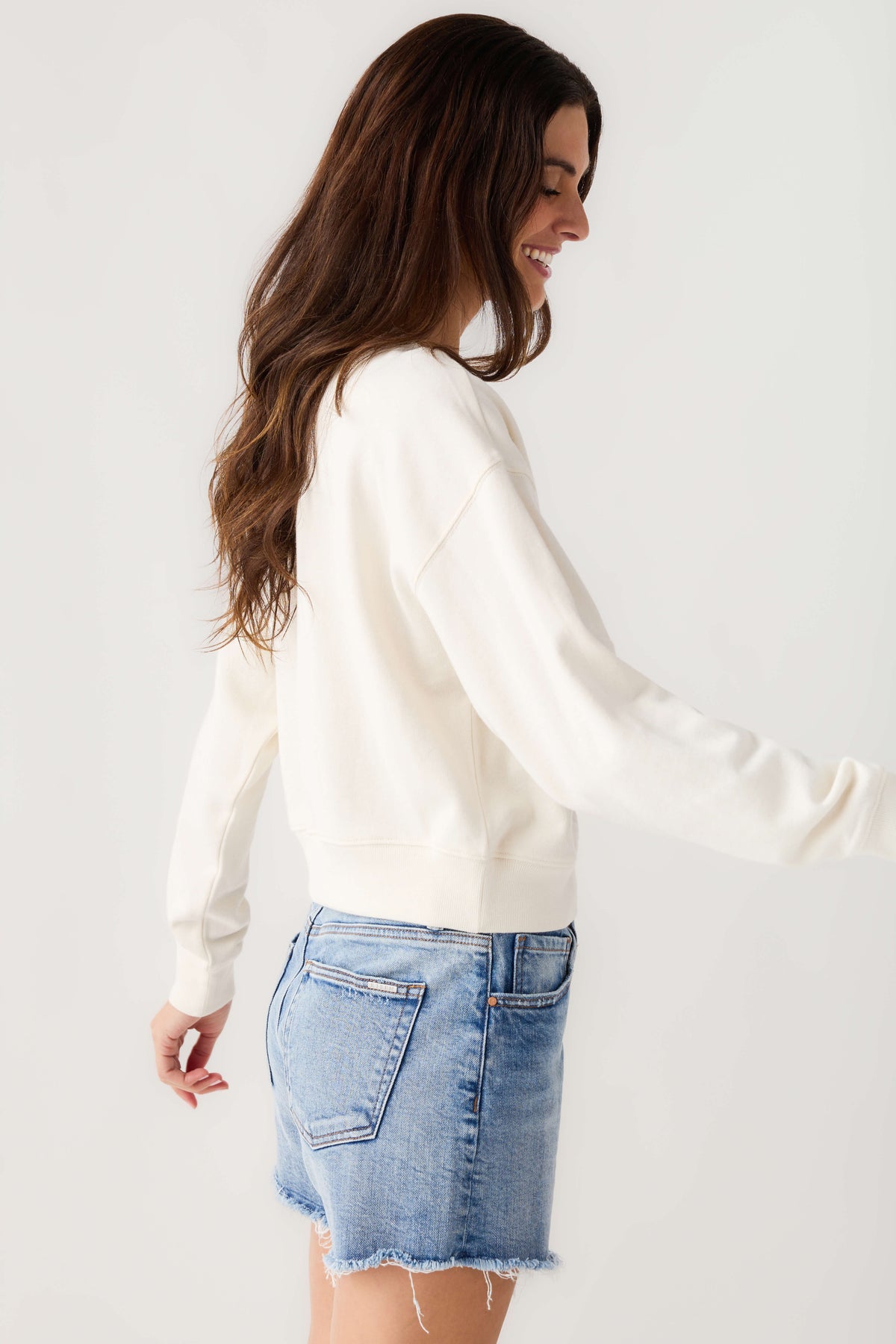 Cloud crewneck sweatshirt in back view, long sleeves with ribbed cuffs