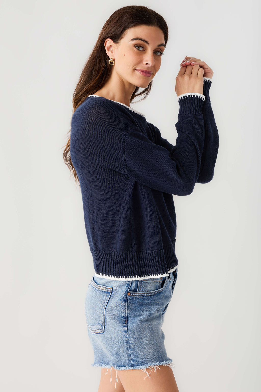 Navy long-sleeve sweater with ribbed cuffs and hem; 'COASTAL' logo on front