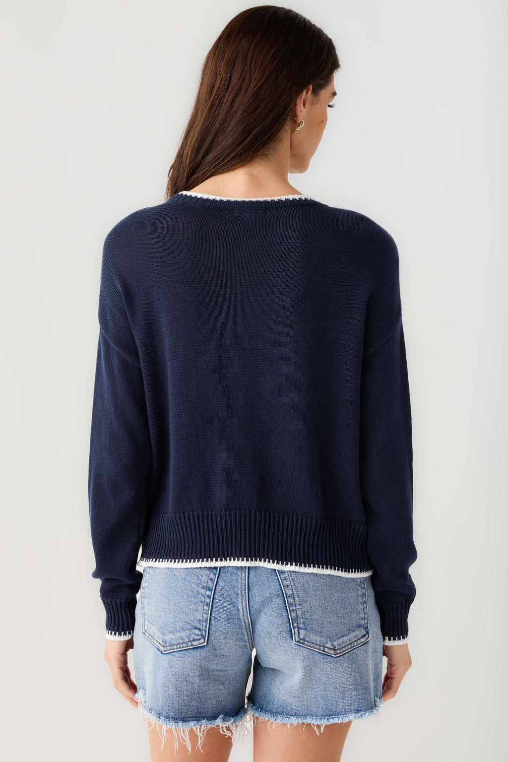 Navy knit sweater back view with ribbed hem and cuffs