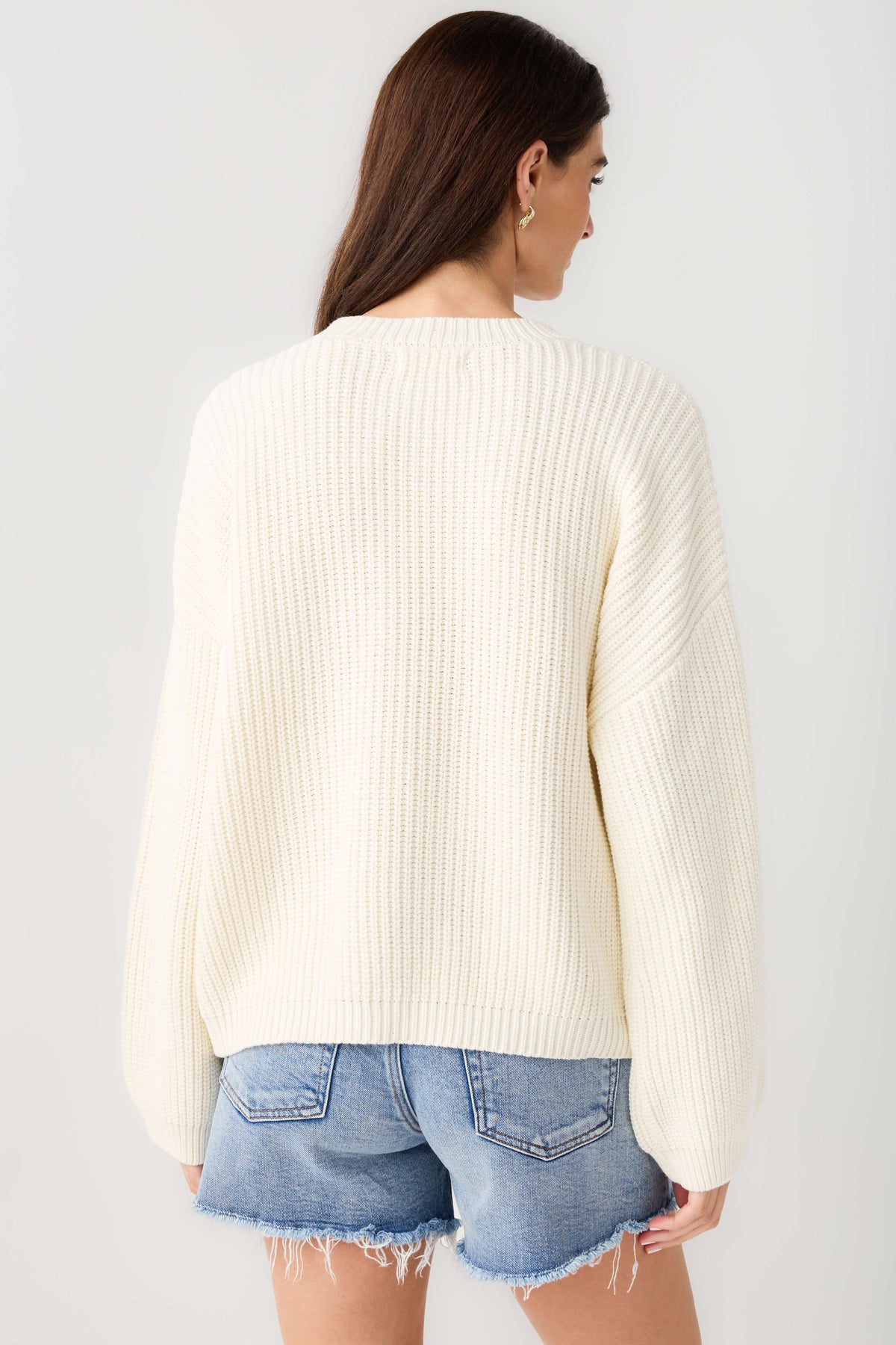 Cream knit pullover top, back view with ribbed crew neck and long sleeves