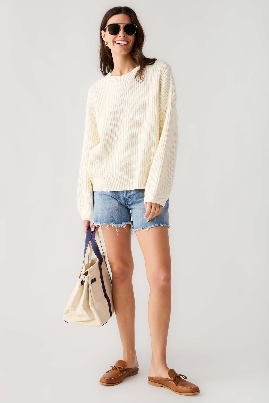 Cream knit pullover top with crew neck and long sleeves, relaxed fit