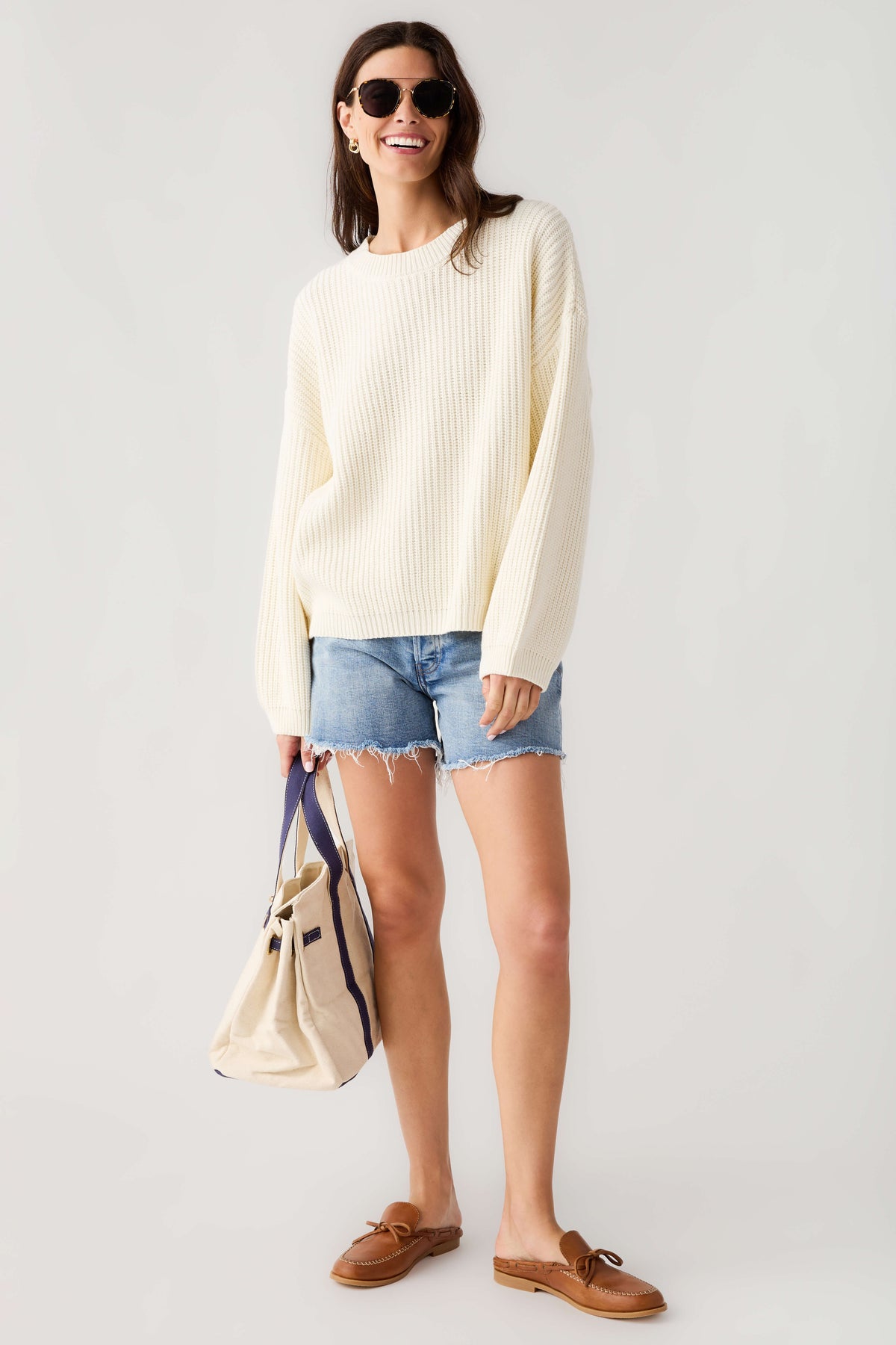 Cream knit pullover top with crew neck and long sleeves, relaxed fit