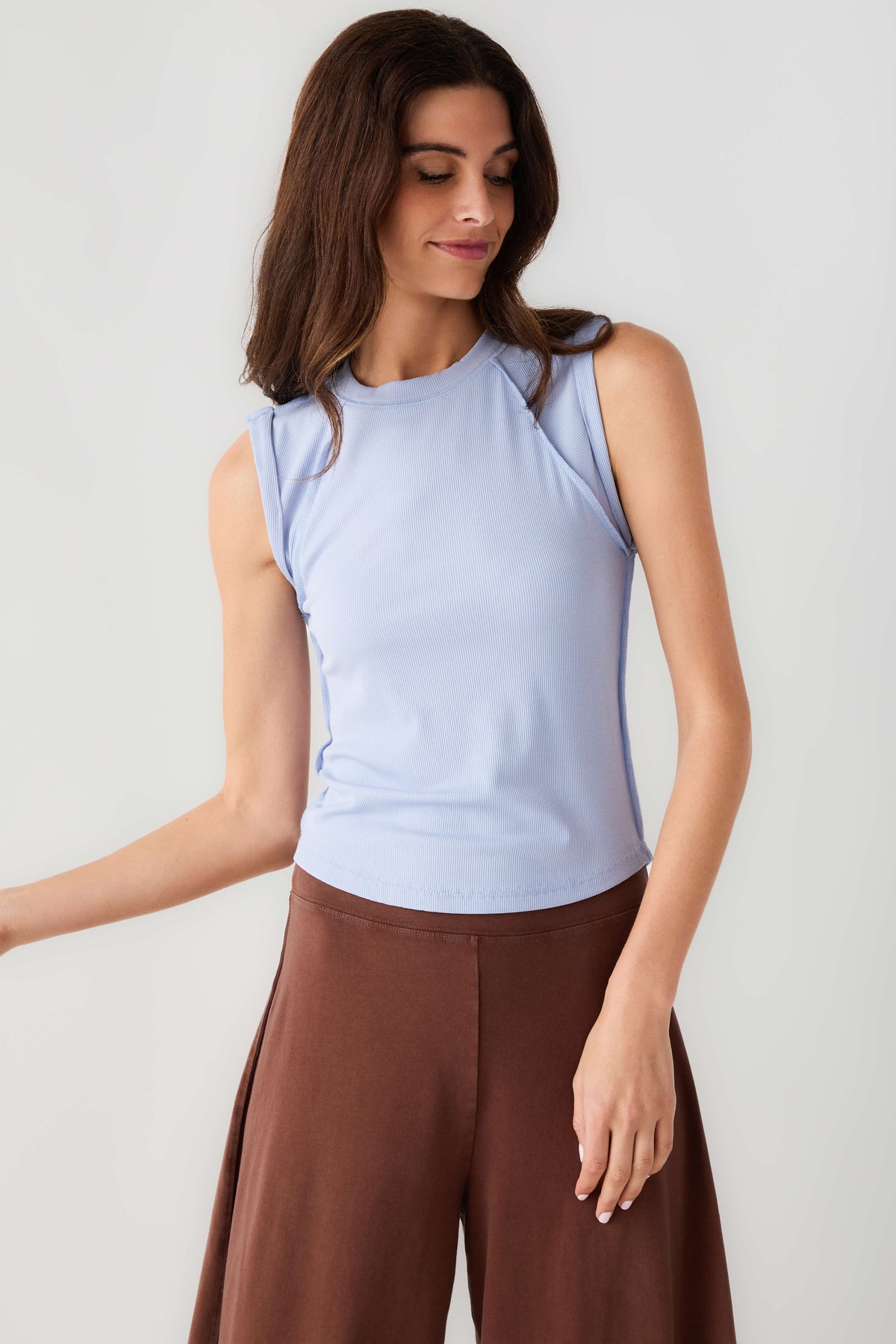 Light blue muscle tank with sleeveless crew neck and smooth fitted front