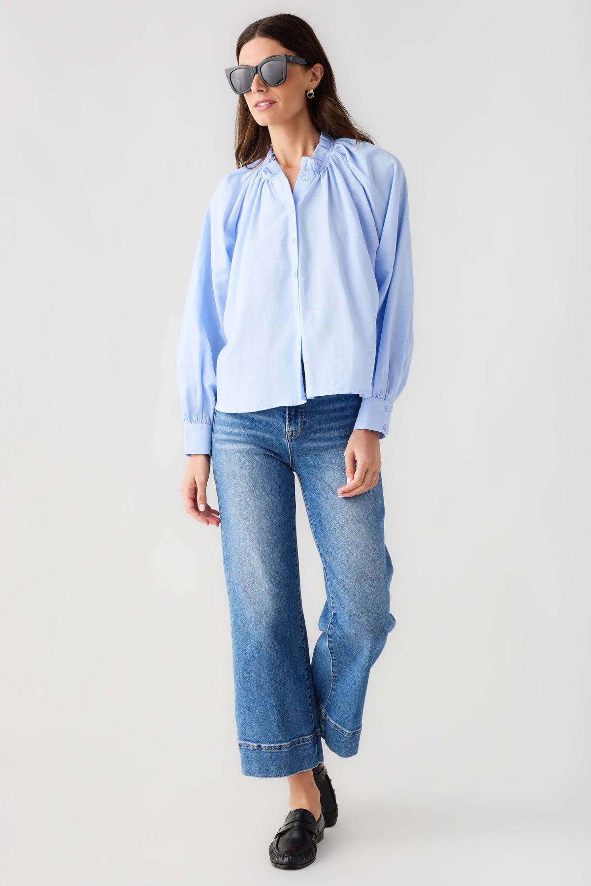 Light blue ruffle button-down top with gathered neckline and long balloon sleeves