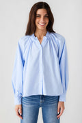 Light blue ruffle button-down blouse with button front, gathered yoke, balloon sleeves