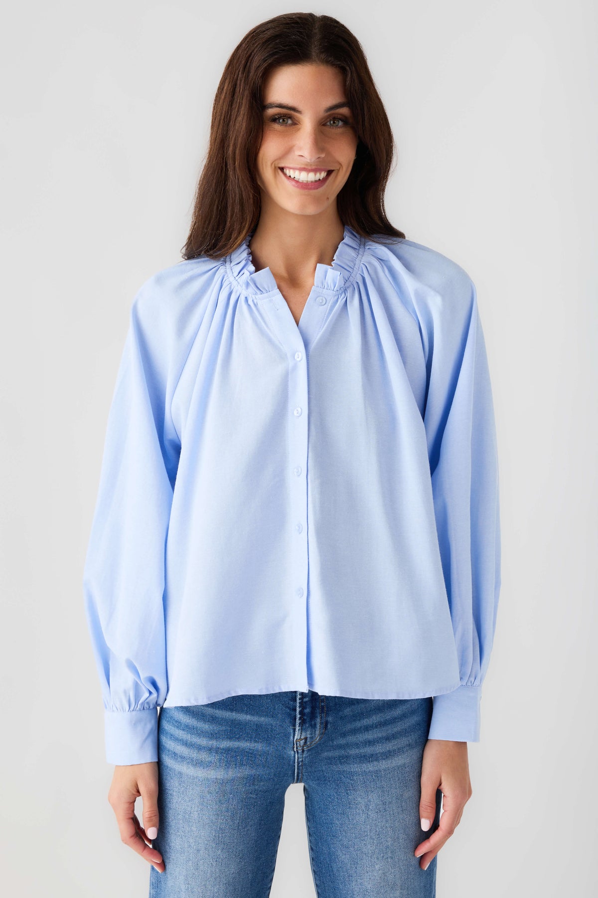 Light blue ruffle button-down blouse with button front, gathered yoke, balloon sleeves